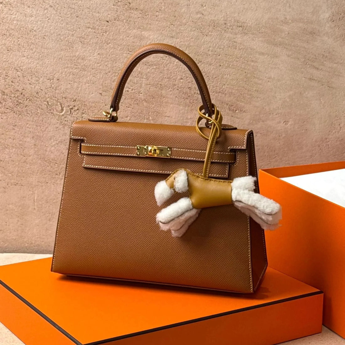 Hermès Kelly 25 Sellier in Gold Epsom leather with gold-tone hardware.