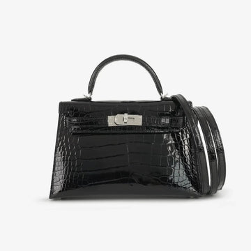 Hermès Mini Kelly (Kelly II Sellier Mini 20) handbag presented inside an orange-trimmed gift box with a branded dust bag