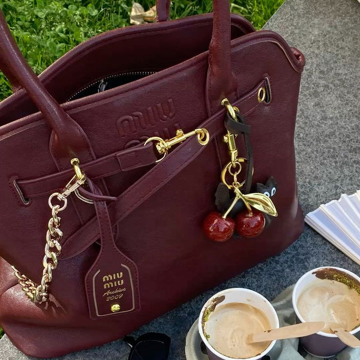 Miu Miu Aventure Nappa Leather Top-Handle Bag in the Amaranth Red (burgundy) colorway