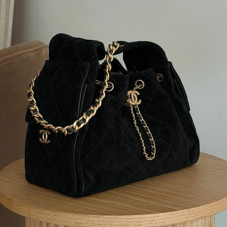 Chanel 25 Hobo Bag with gold-tone hardware and the iconic interlocking CC logo