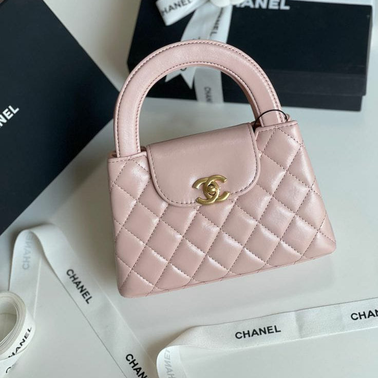 Chanel Shiny Aged Calfskin Quilted Nano Kelly Shopper in light pink with brushed gold-tone hardware