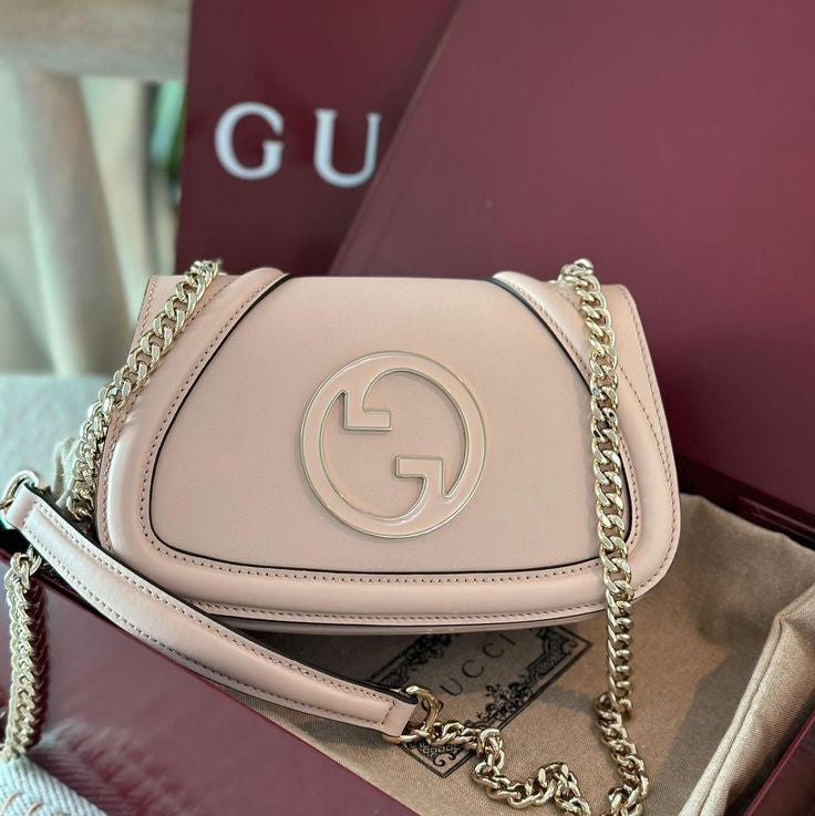 Gucci Blondie Mini/Small Shoulder Bag with a signature circular Interlocking G logo and gold-tone chain strap
