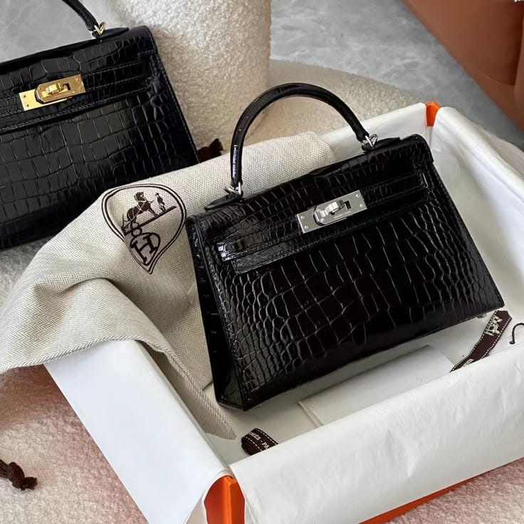 Hermès Mini Kelly (Kelly II Sellier Mini 20) handbag presented inside an orange-trimmed gift box with a branded dust bag
