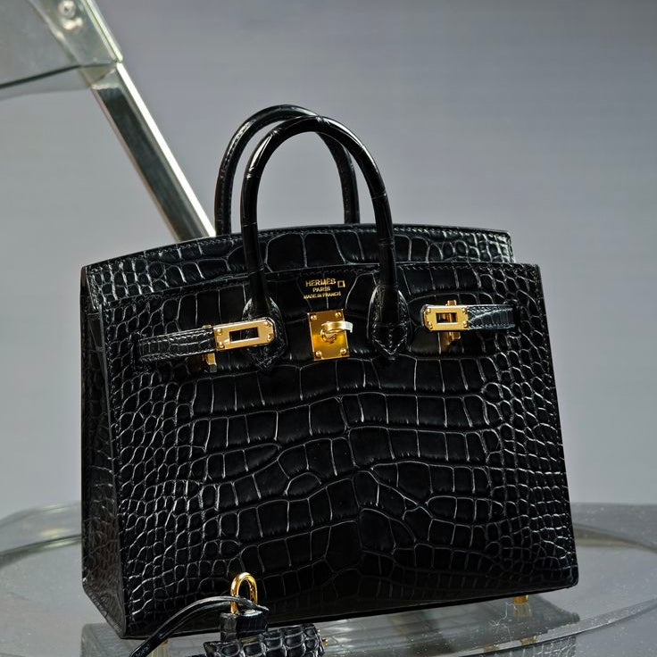 Hermès Birkin Bag crafted in black shiny exotic crocodile leather with gold-tone hardware