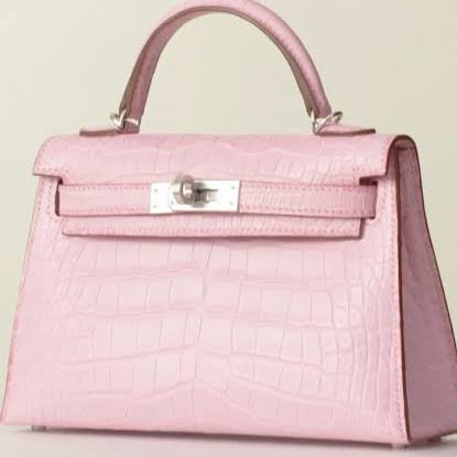 pink Hermès Mini Kelly Sellier bag crafted from exotic matte alligator leather with palladium hardware