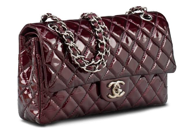 Chanel Classic Flap Bag in a glossy burgundy patent leather with gold-tone